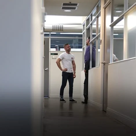 IMG_0029 men talking in hallway at inpatient addiction treatment center