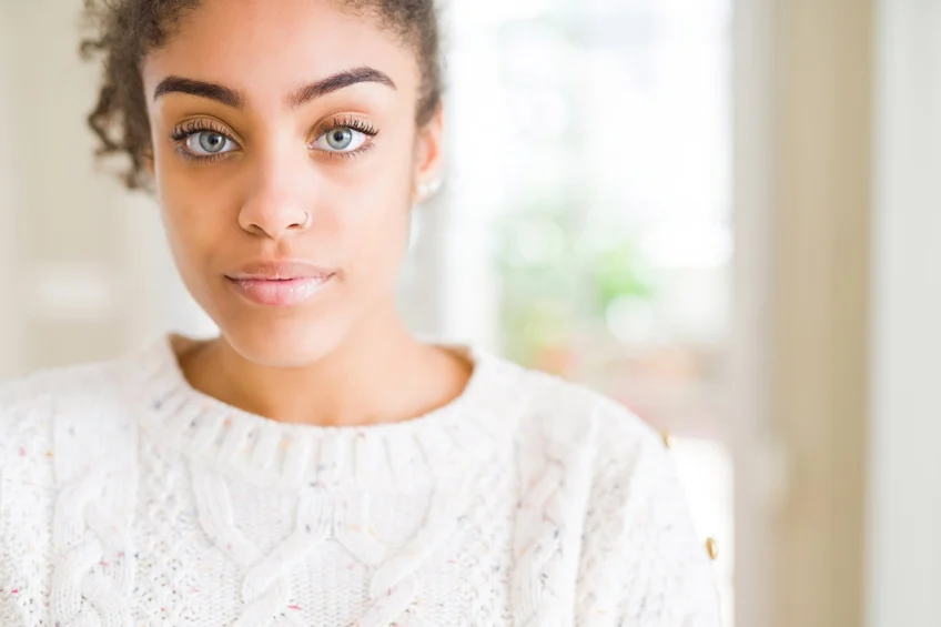 woman looking at viewer sternly wondering do I need dual diagnosis treatment