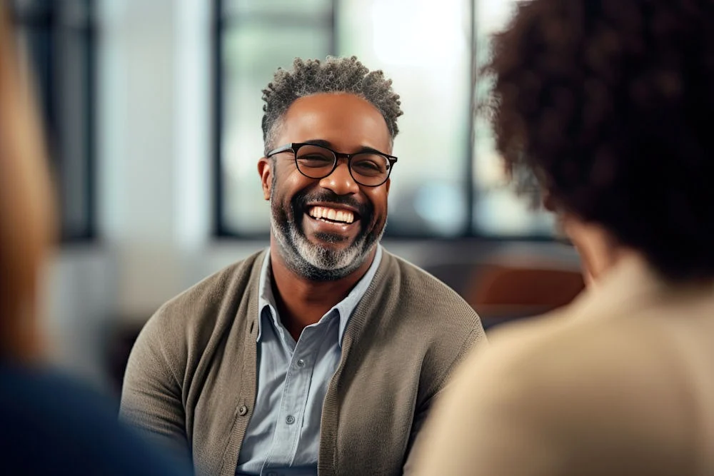 a man smiling during therapy