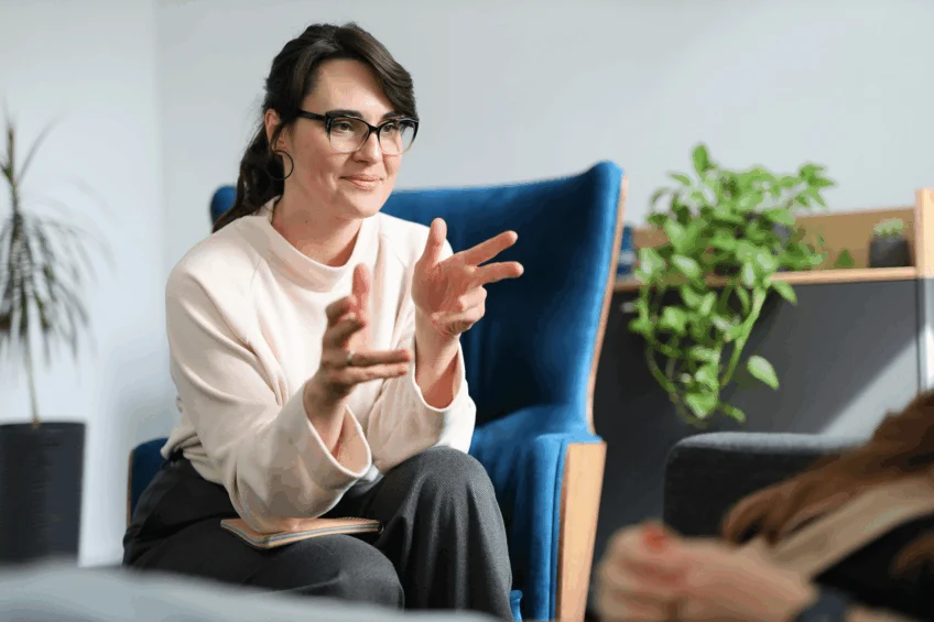 A therapist discussing health and recovery topics, including how long alcohol stays in your system, with a client.