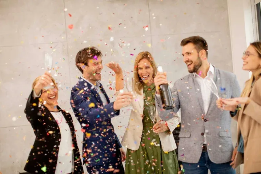 group of co-workers celebrating mental health as they set New Year’s goals