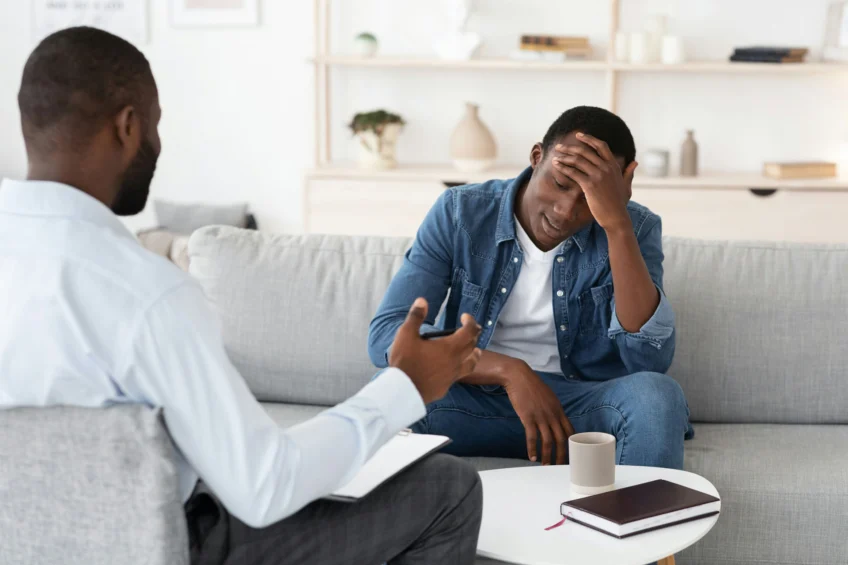 man getting guidance from therapist for social anxiety