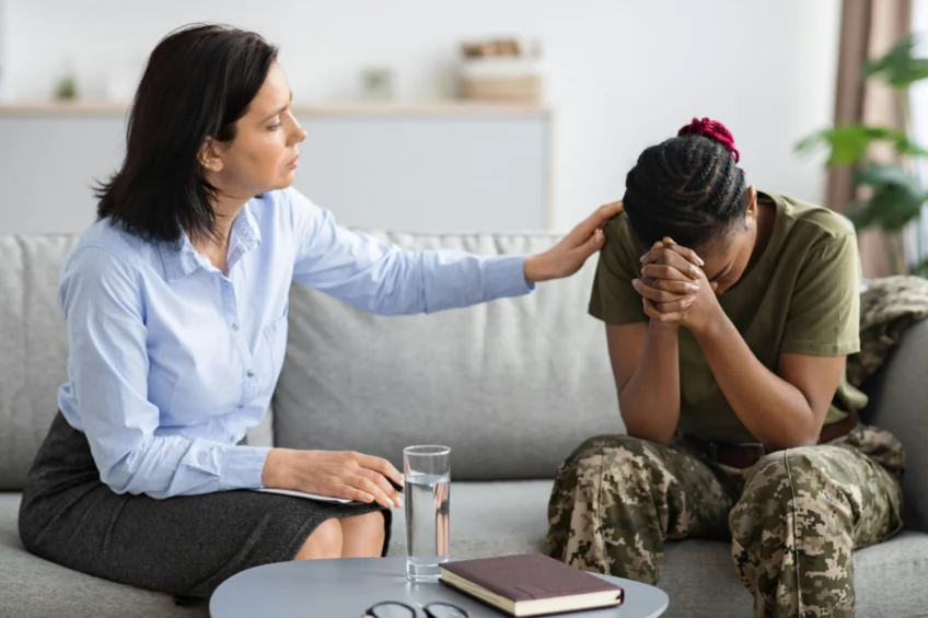 Veteran attending therapy as her therapist helps treat signs of complex PTSD
