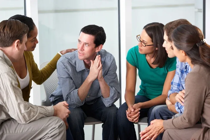 therapist leading a group session on cocaine addiction treatment