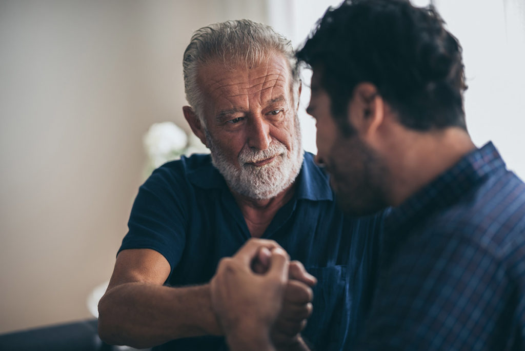 older man showing how to help a loved one in recovery