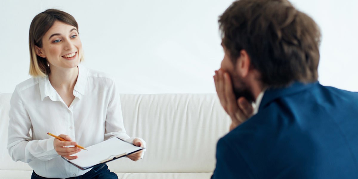 therapist talking with patient about preventing relapse