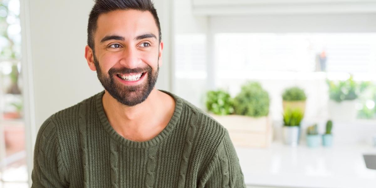 guy smiling after learning how sober living homes could prevent relapse