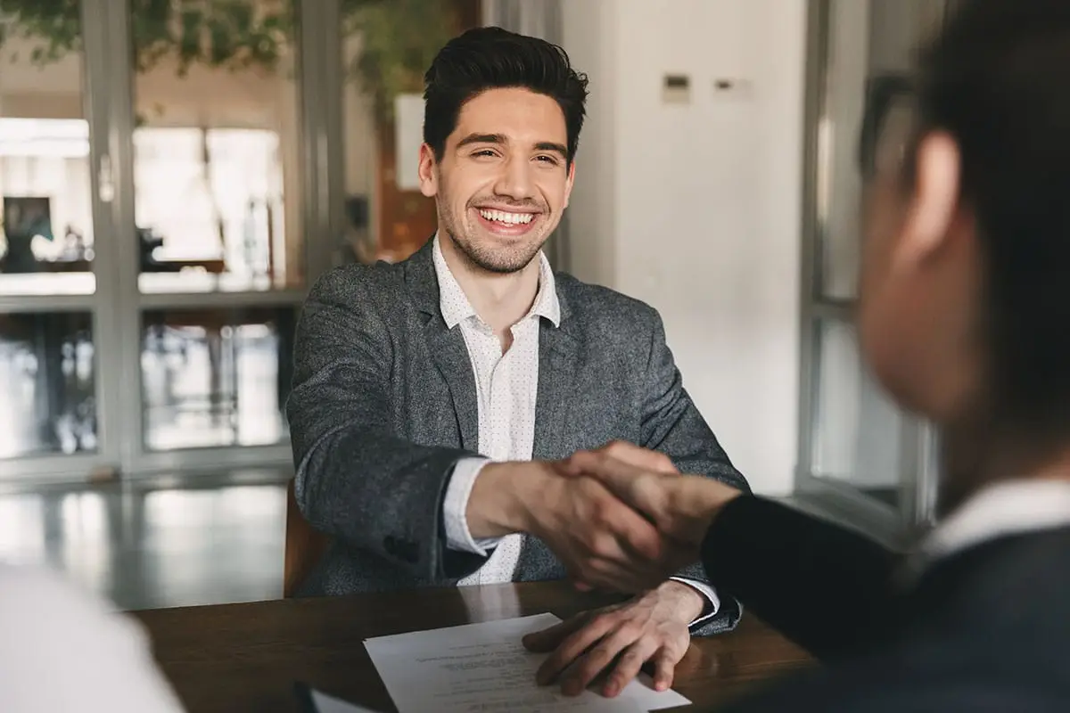man shaking a womans hand