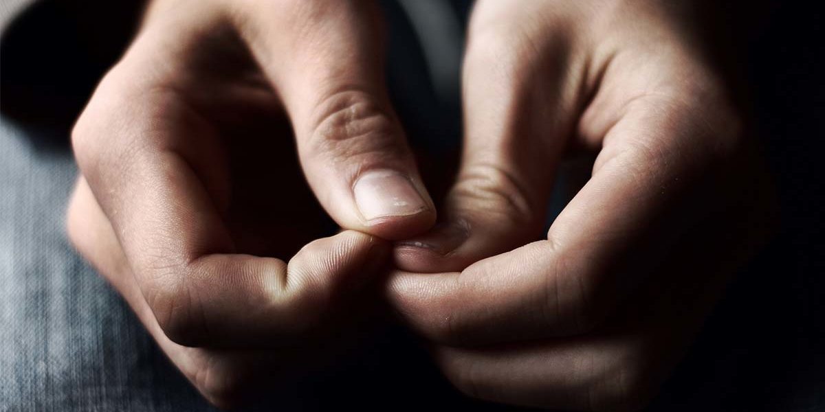 close up of hands of individual with depression and anxiety