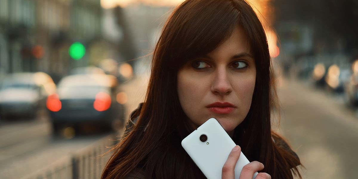 woman holding smartphone social media and substance abuse