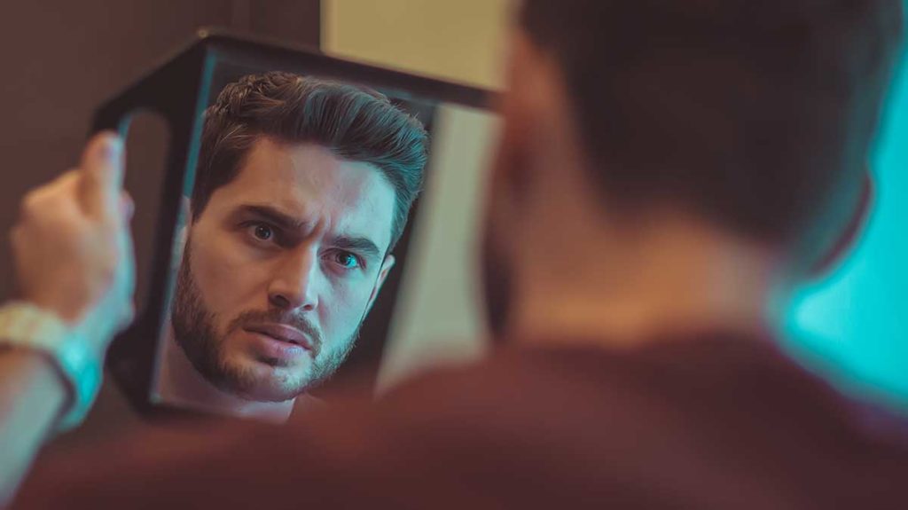 a man looking into mirror wondering what is borderline personality disorder