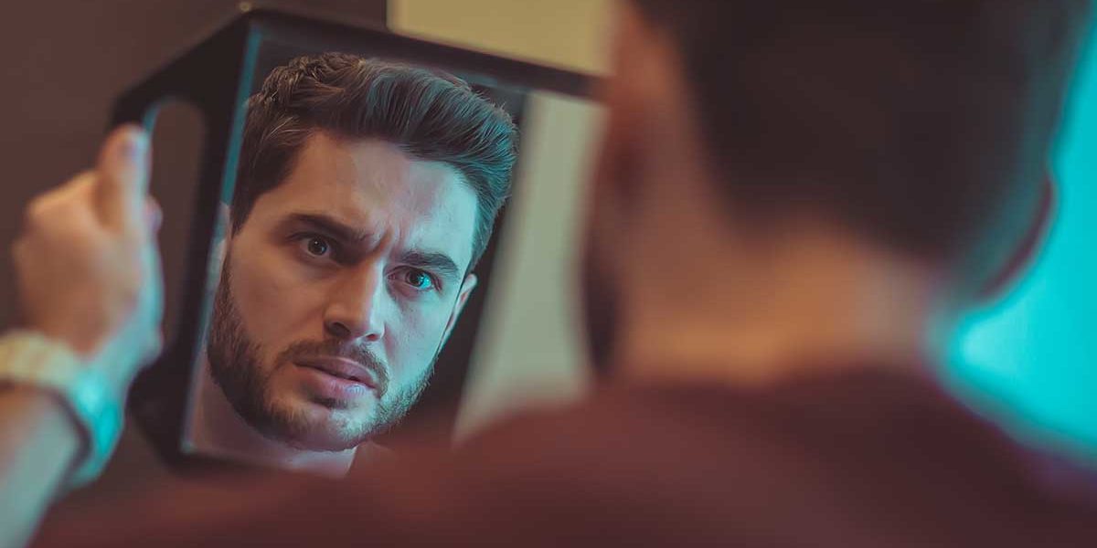 a man looking into mirror wondering what is borderline personality disorder