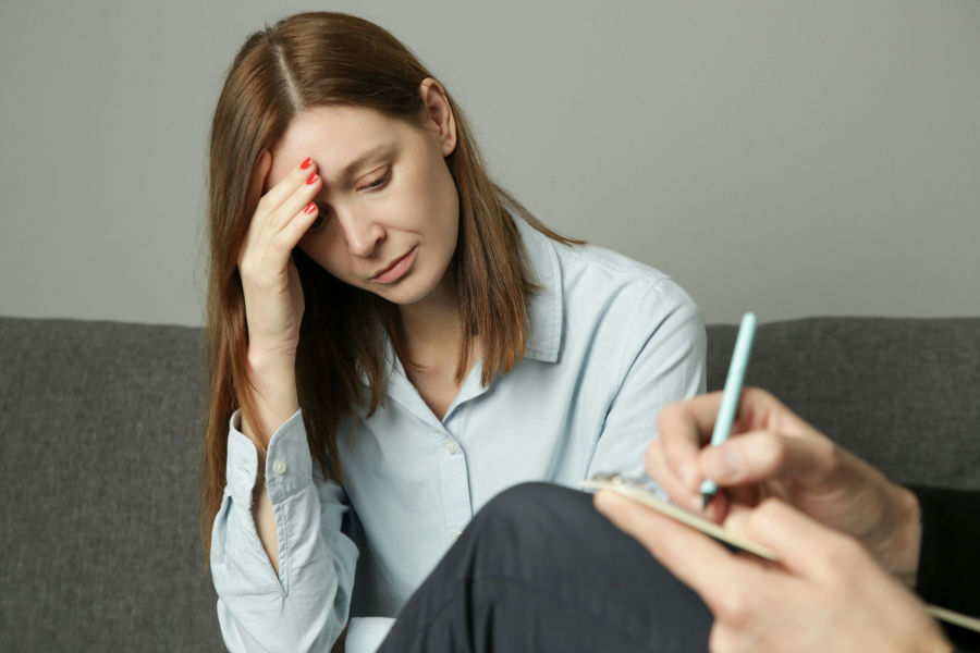 therapist explaining to patient how grief and substance abuse are linked