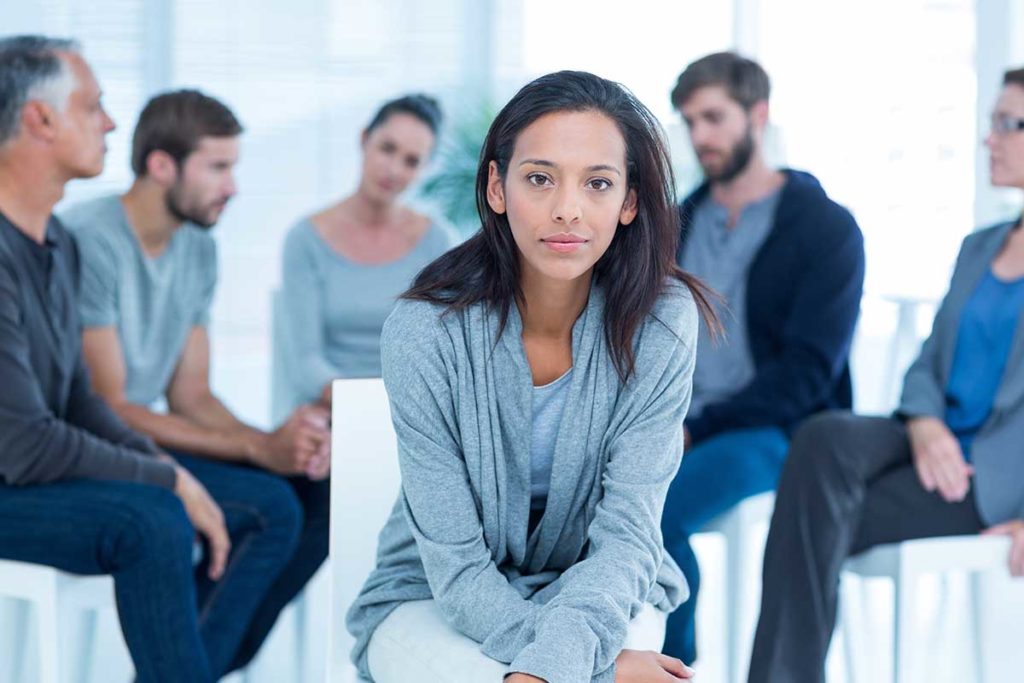 a woman participates in drug rehab centers