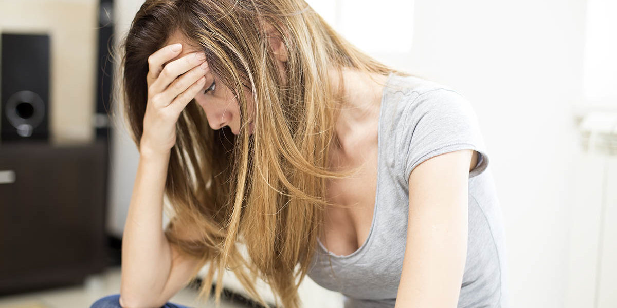 woman struggles with symptoms of meth addiction