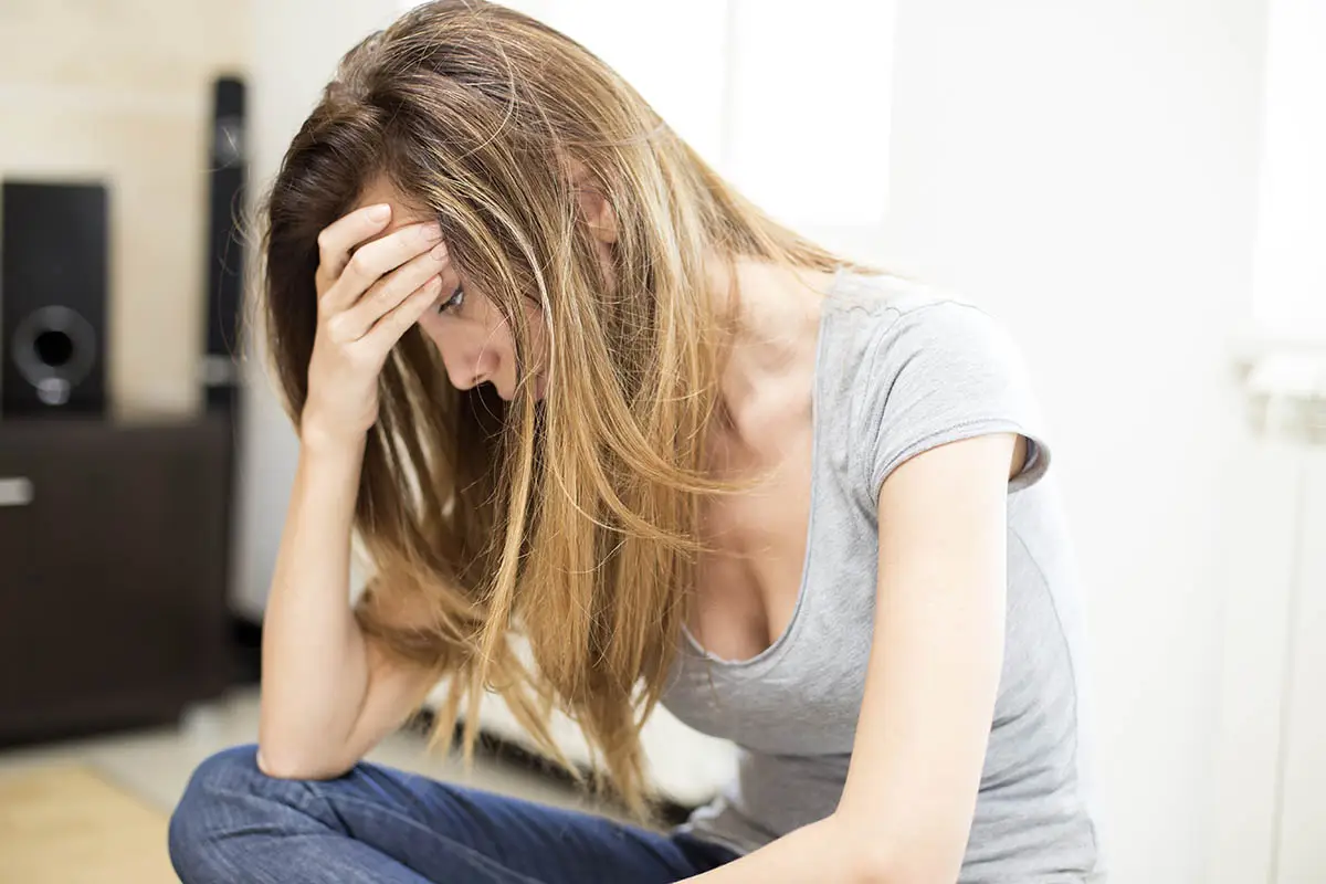 woman struggles with symptoms of meth addiction