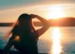 woman looking at sun rise trying to have a sober new year