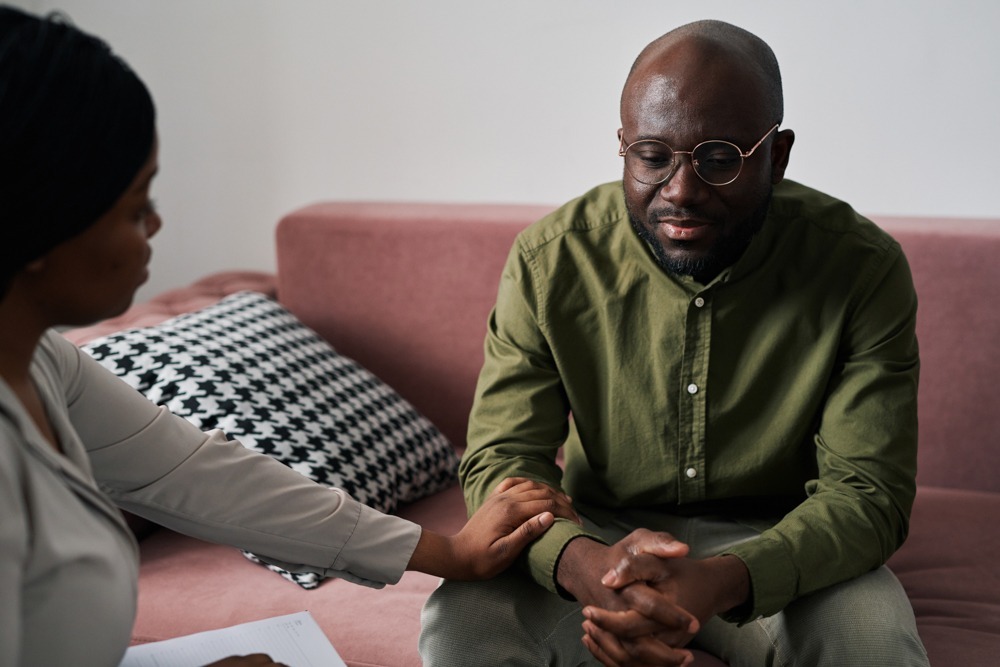 a man talking to his therapist about microdosing mushrooms