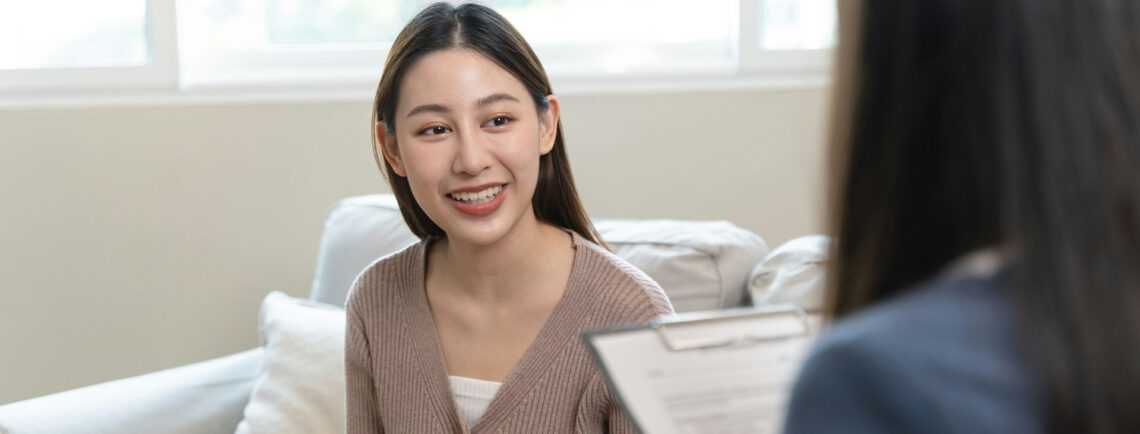 a-woman-smiling-in-individual-therapy