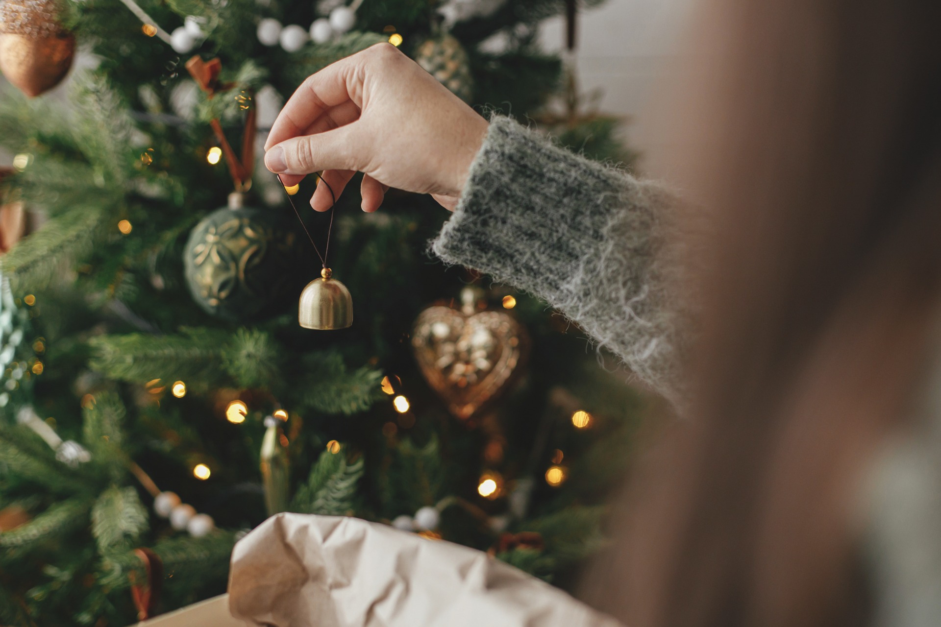 a-girl-hanging-ornaments-on-the-tree