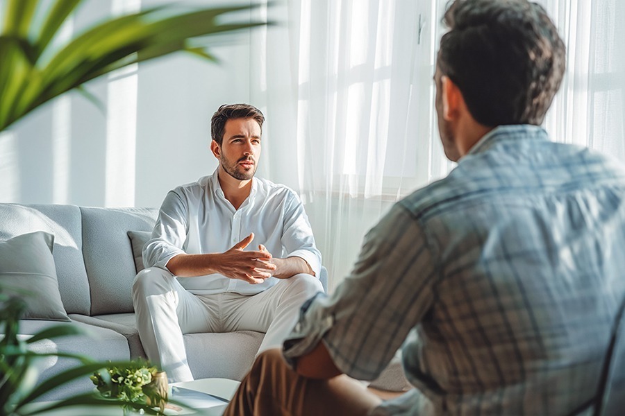 a man speaking to therapist in individual therapy