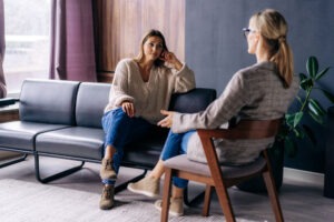 a-woman-discussing-her-triggers-in-therapy