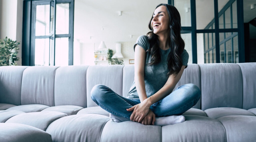 a-girl-smiling-alcohol-free-on-the-couch