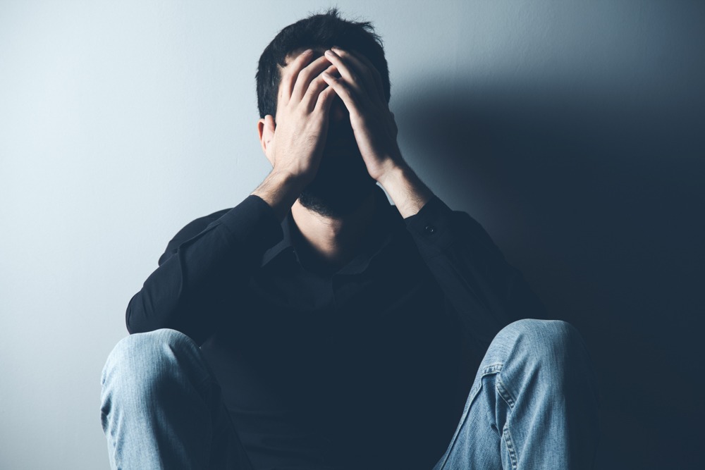 A man managing symptoms of a manic episode
