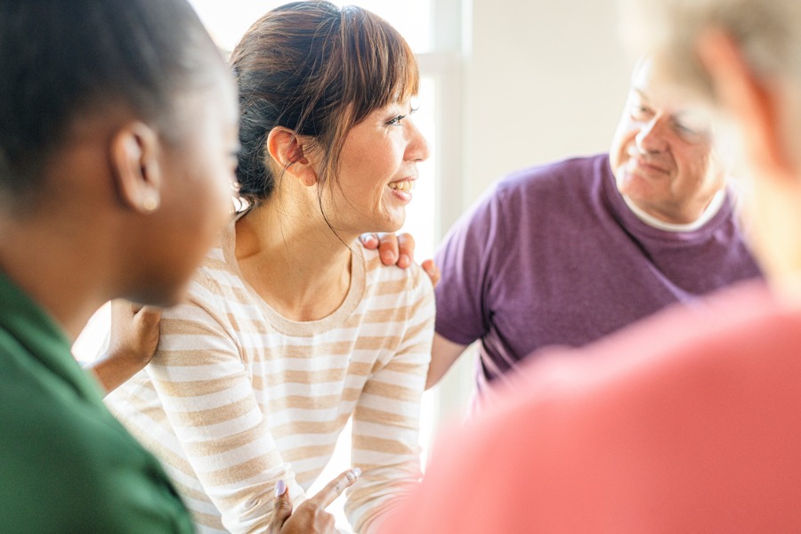 a-woman-being-comforted-in-group-therapy