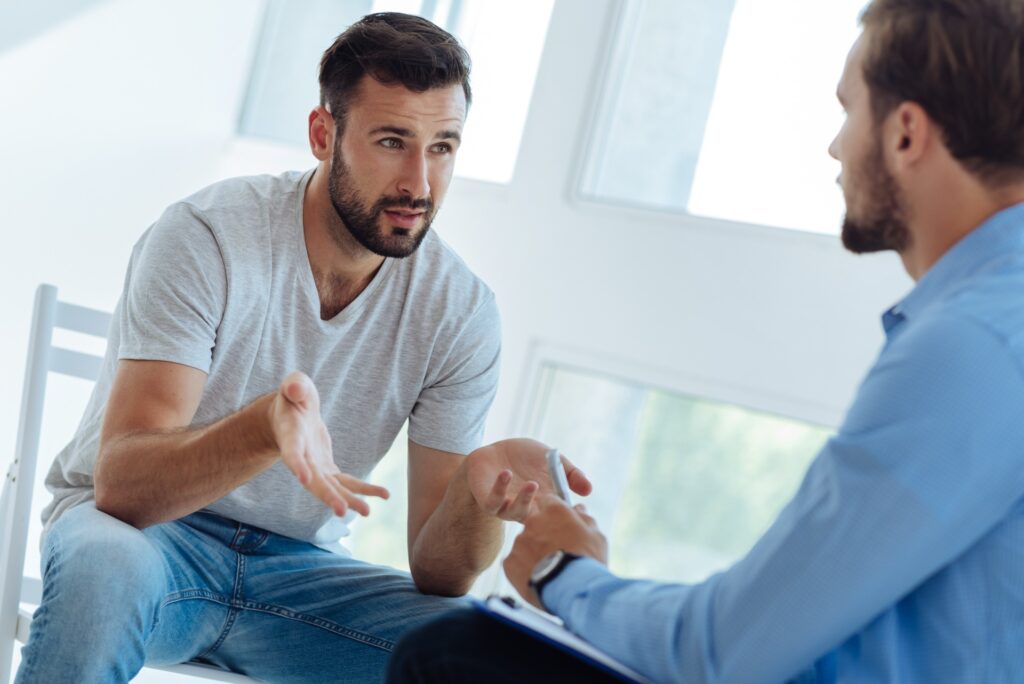 a man speaking in individual therapy