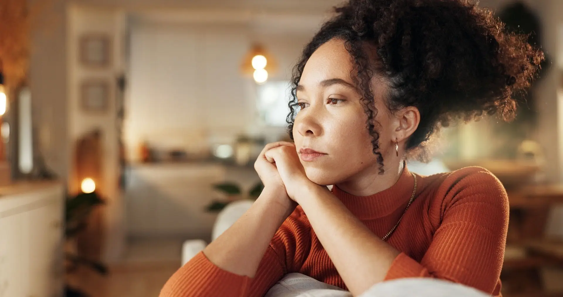 a woman with hand on head in therapy