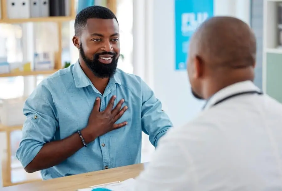 a man suffered from substance abuse speaking to a therapist