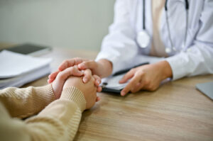 A medical professional offers compassionate support at best inpatient chronic pain treatment centers