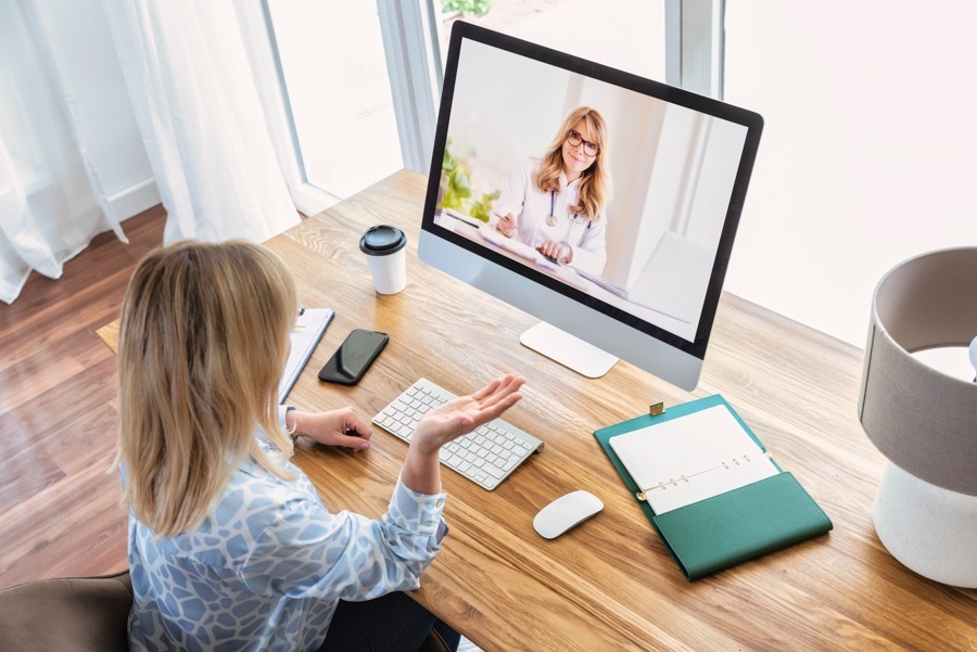 virtual-iop-programs-near-me a woman video calling her therapist during virtual iop