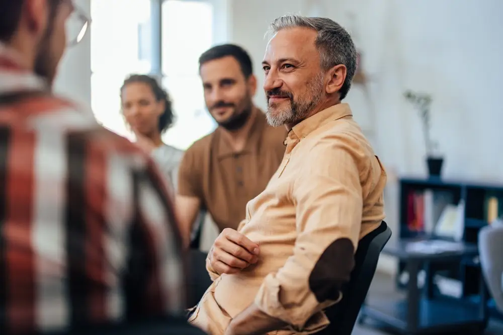 men in group therapy for addiction treatment in los angeles