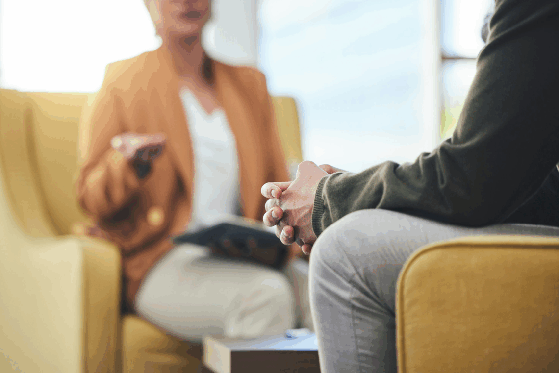 a therapist speaking to patient