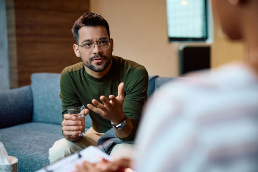man on a couch asking his therapist how long opioids remain in the body