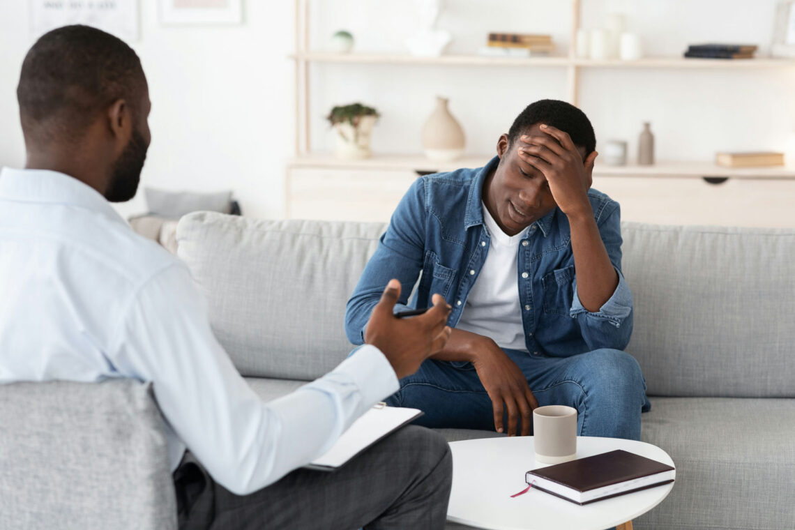 man getting guidance from therapist for social anxiety