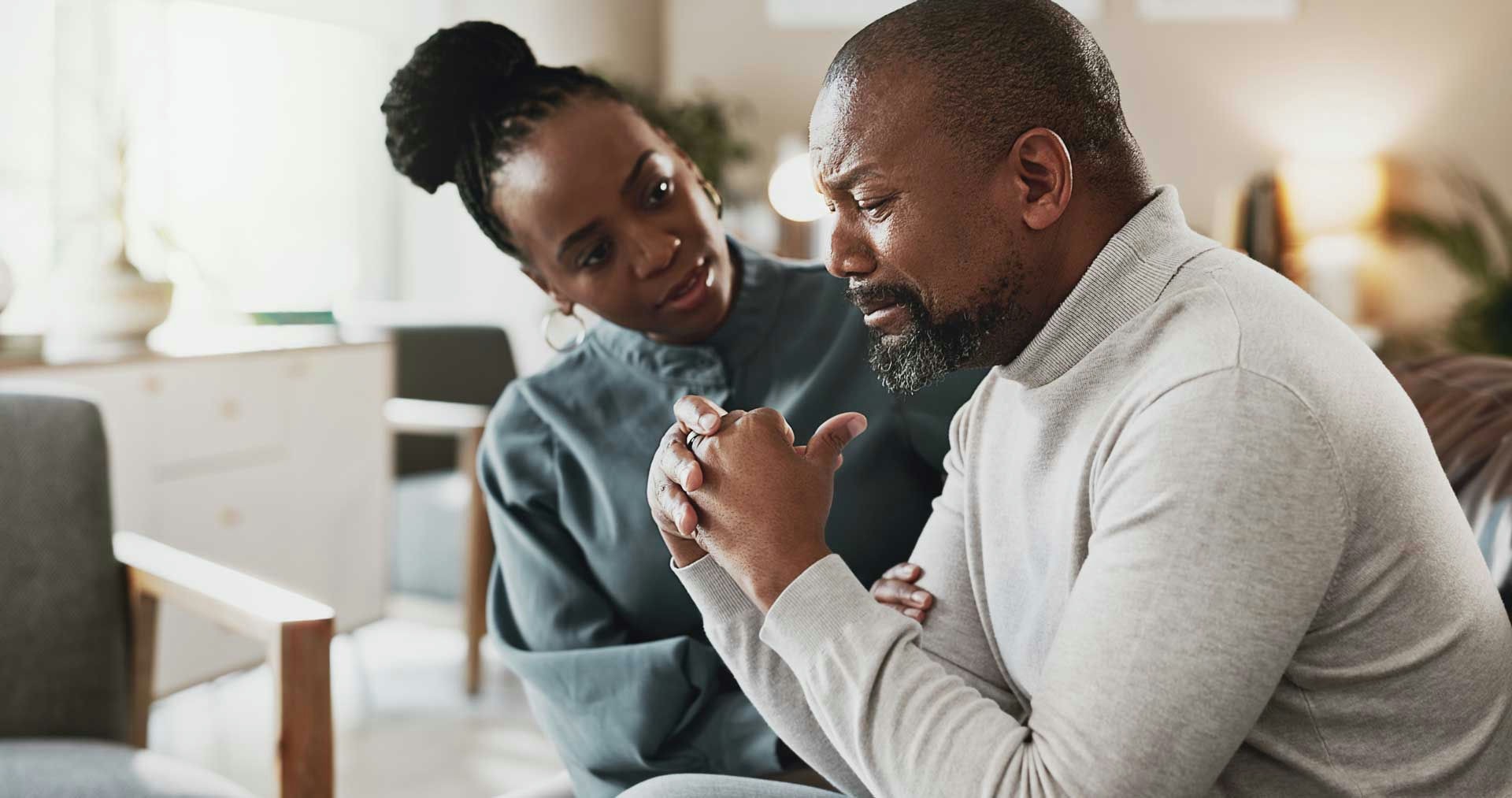 man on the verge of tears in therapy, coping with secondary traumatic stress