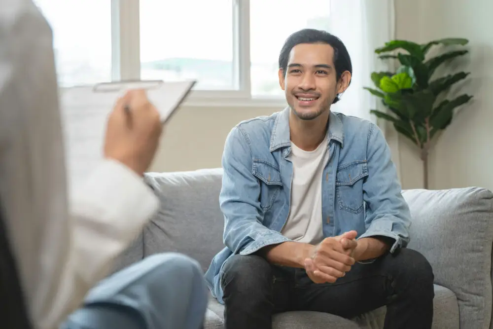 a-man-smiling-in-individual-therapy