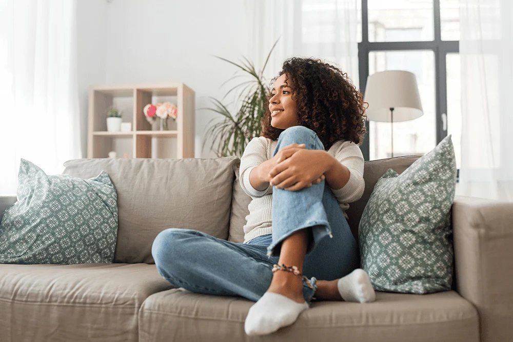 woman on couch attending holistic addiction treatment in Los Angeles