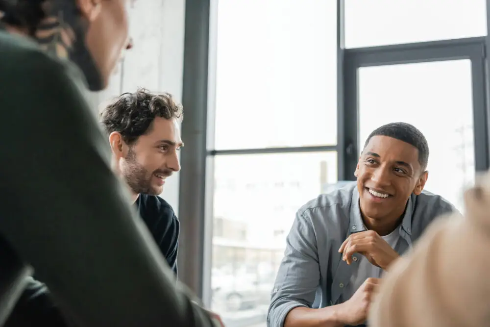 a-group-of-individuals-talking-in-therapy