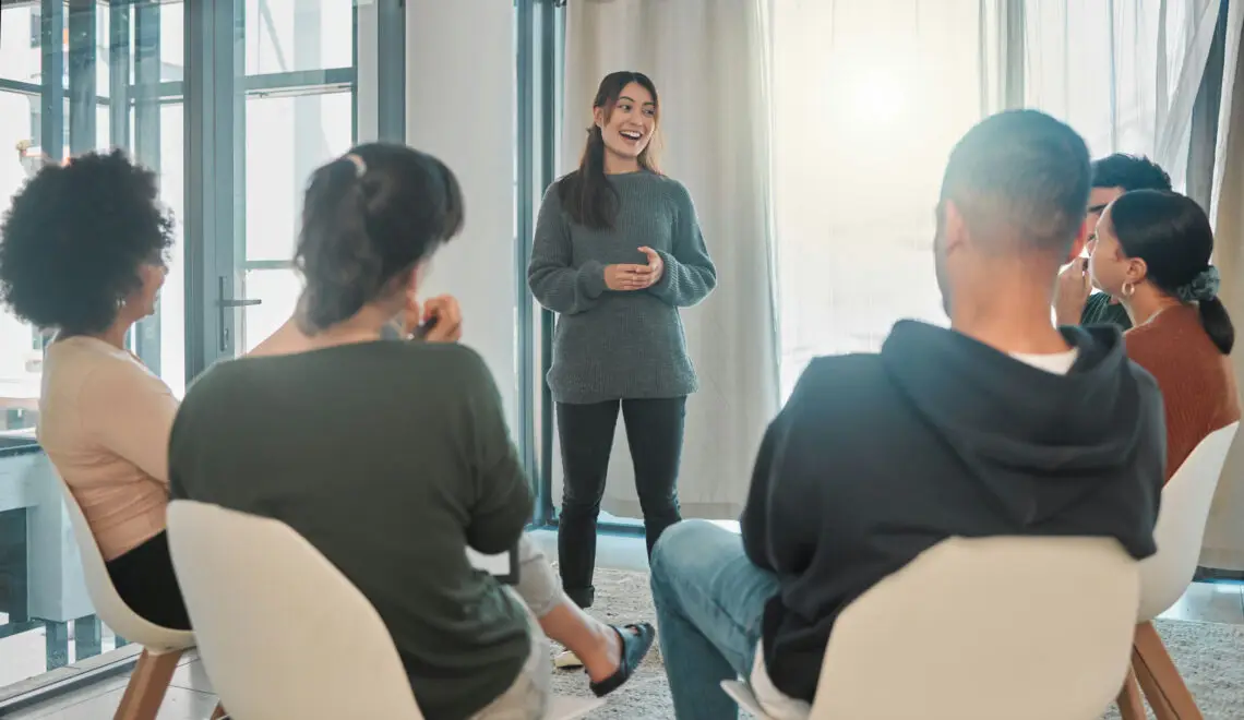 a-woman-speaking-in-group-therapy