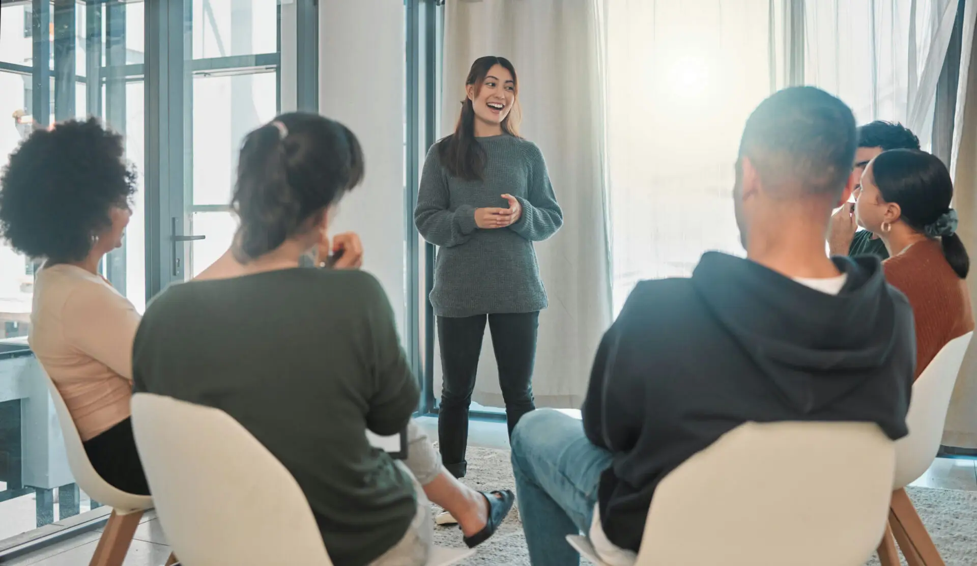 a-woman-speaking-in-group-therapy